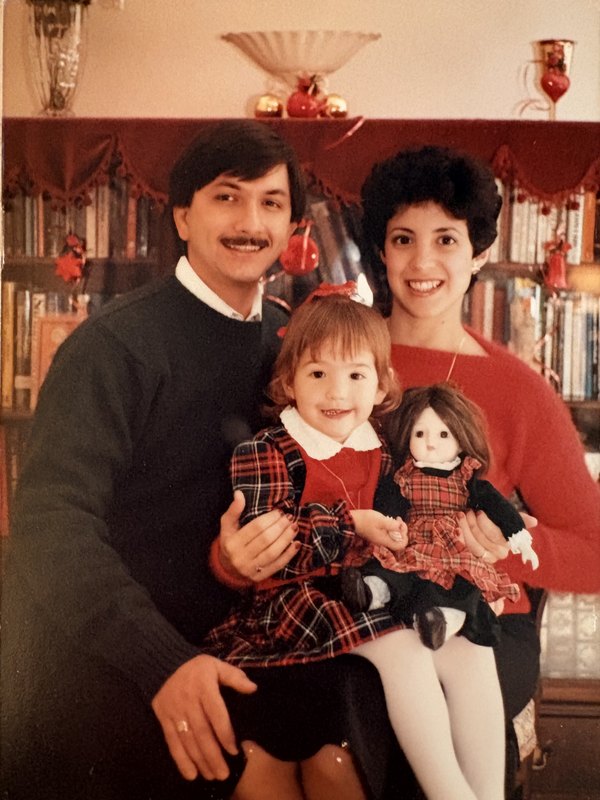 Young Michele with her parents at Christmas